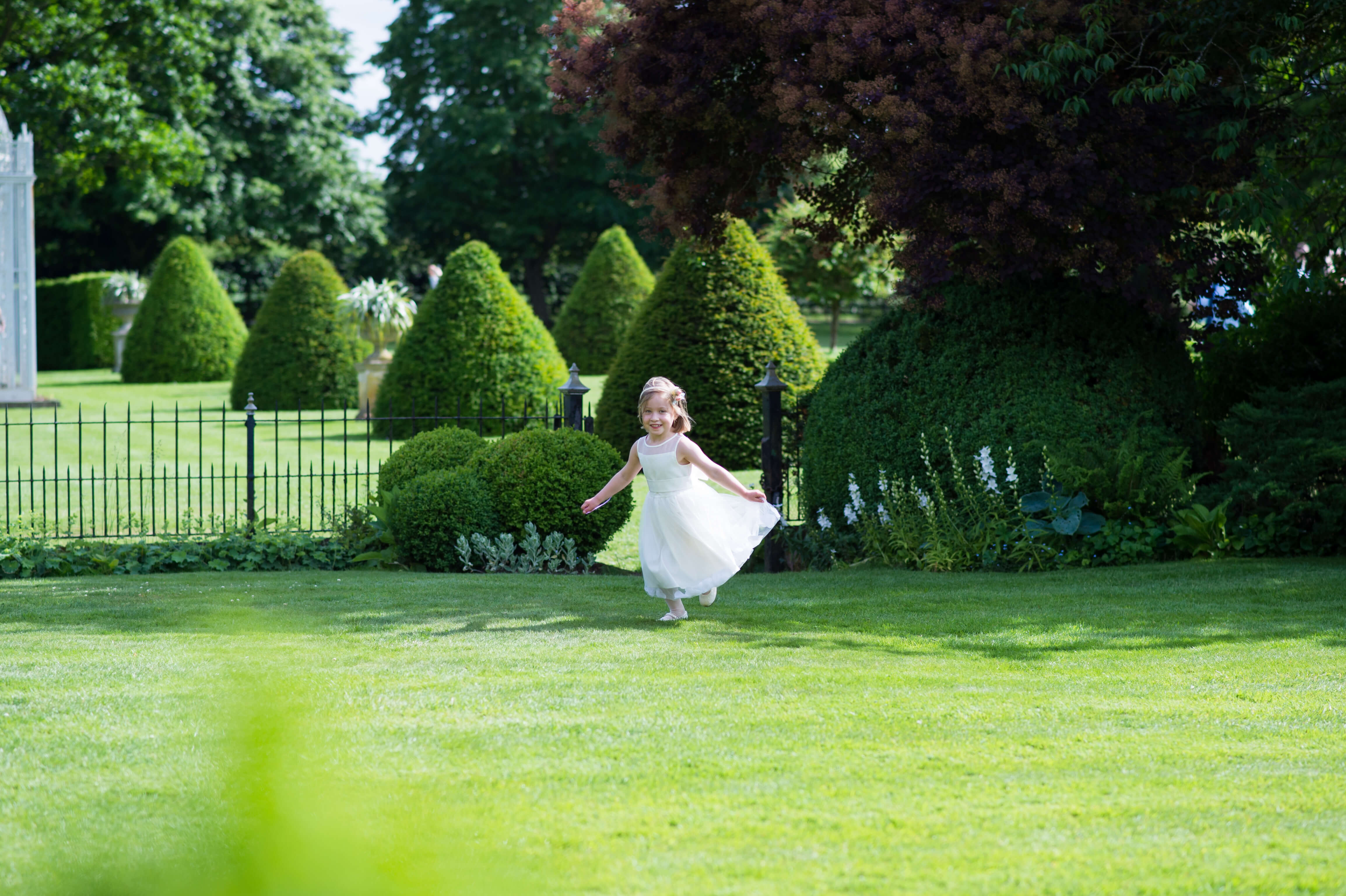 A flower girl in the gardens of Chenies Manor House in Buckinghamshire 